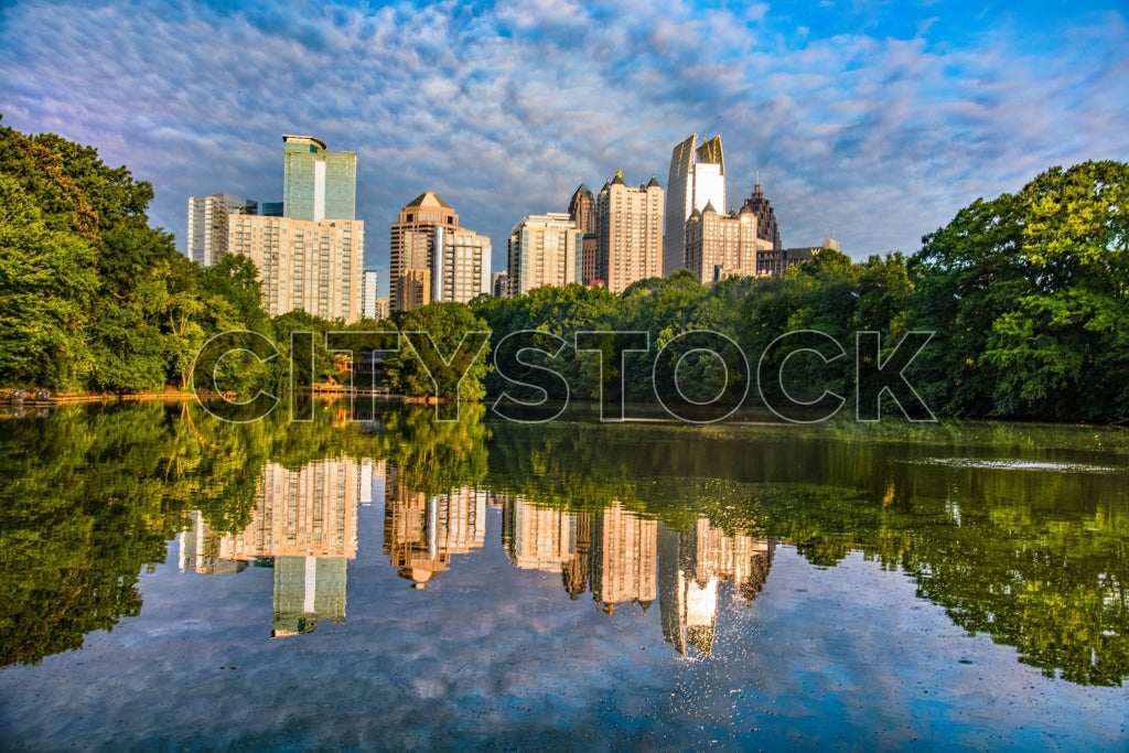 Atlanta city skyline and lake reflecting buildings at dawn