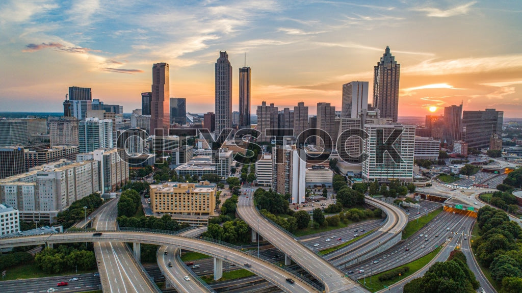 Atlanta’s sunrise view with skyscrapers and highways, vibrant city life.