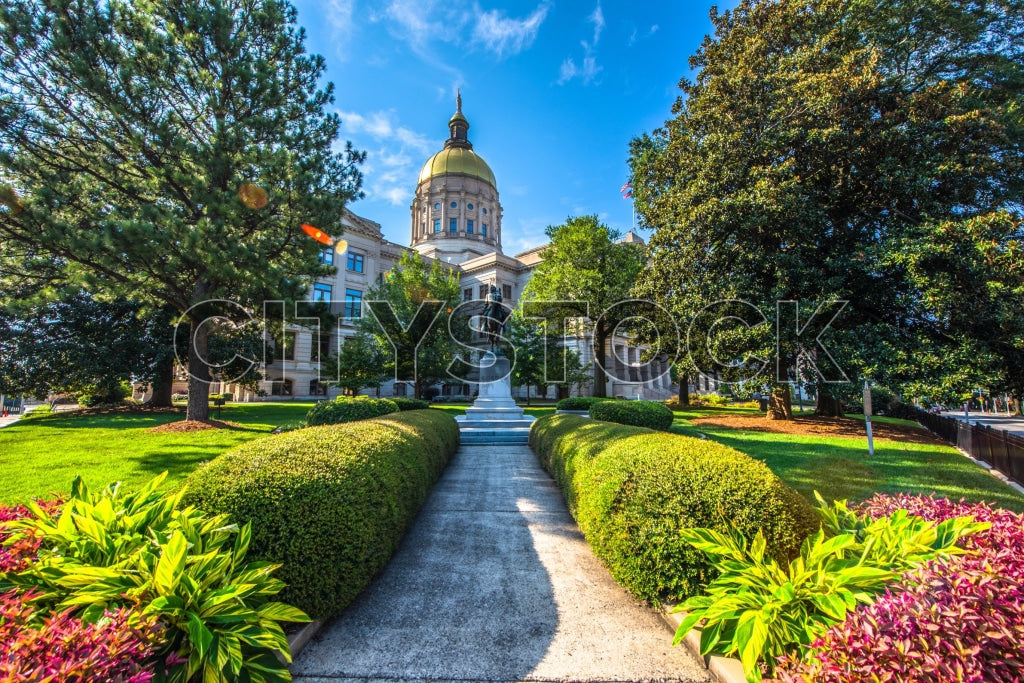 Georgia State Capitol in Atlanta with vibrant gardens under blue sky