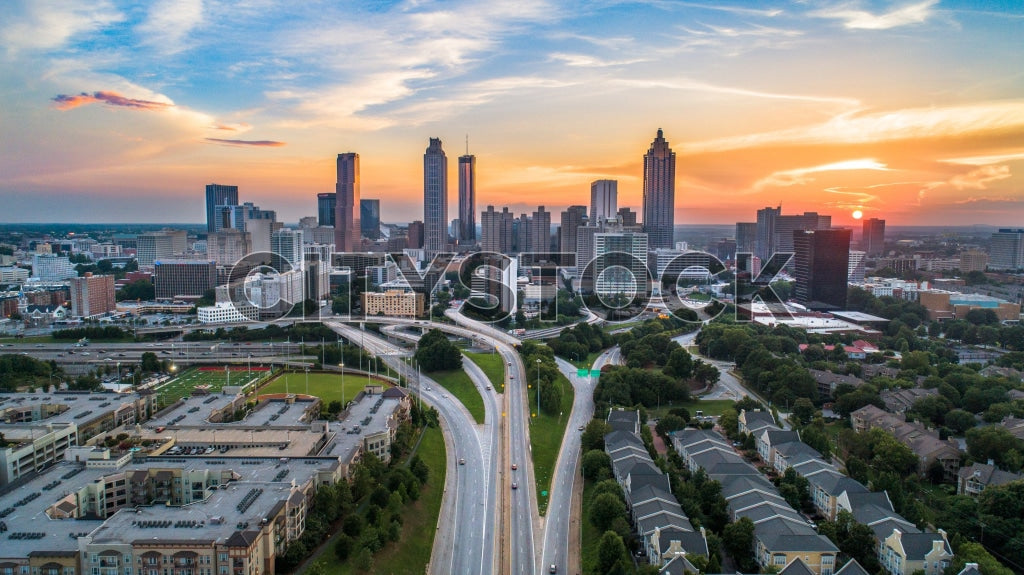 Aerial view of Atlanta skyline at sunrise with prominent city buildings