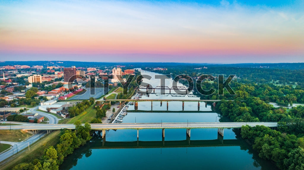 Aerial view of Augusta, GA at sunrise showing city and river