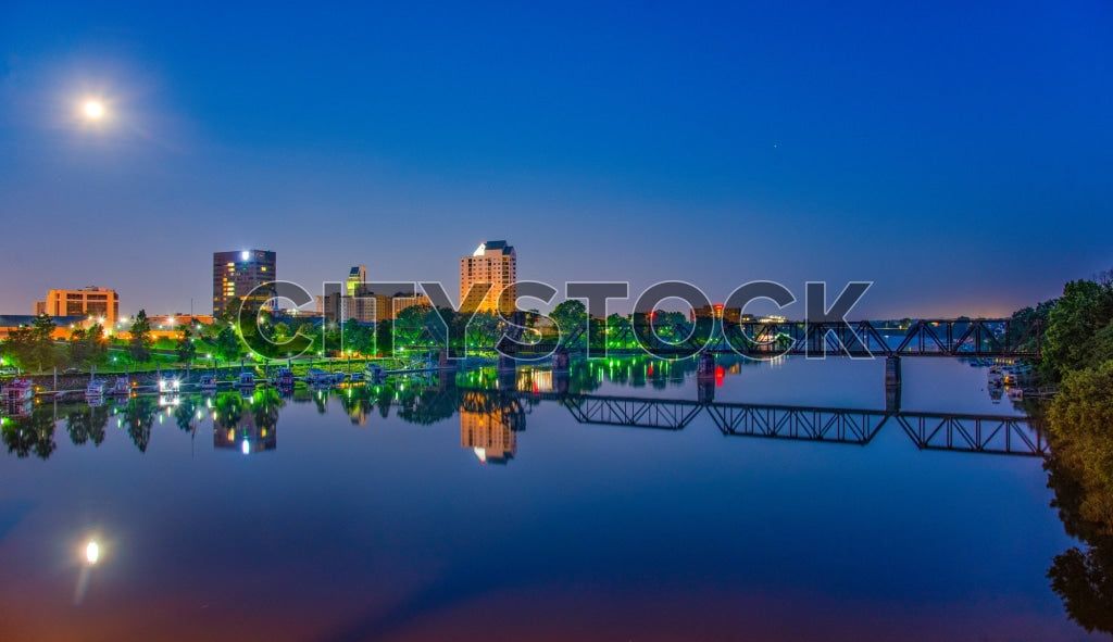 Augusta Georgia skyline and Savannah River at sunrise with moon