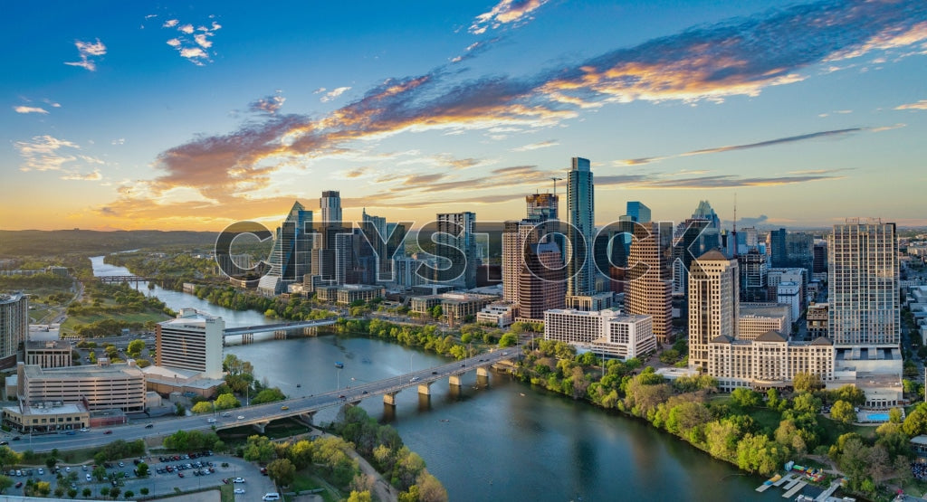 Austin skyline sunrise with Colorado River and city buildings