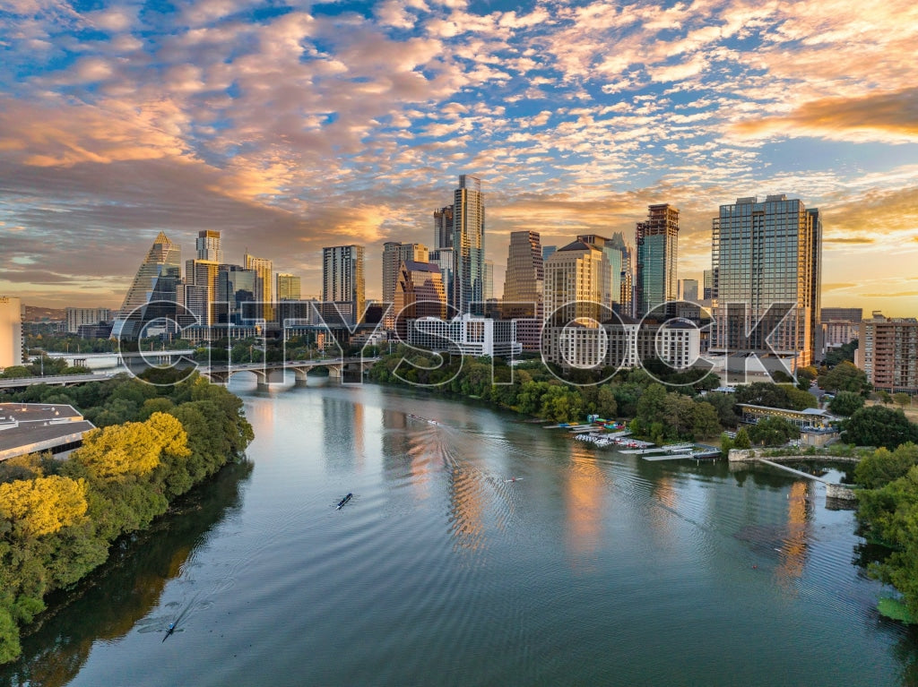 Sunrise illuminating Austin skyline with Colorado River in view