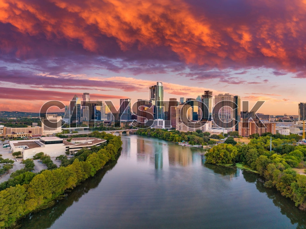 Austin skyline with reflective sunset over river