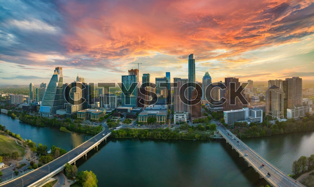 Aerial view of Austin skyline at sunrise with colorful clouds