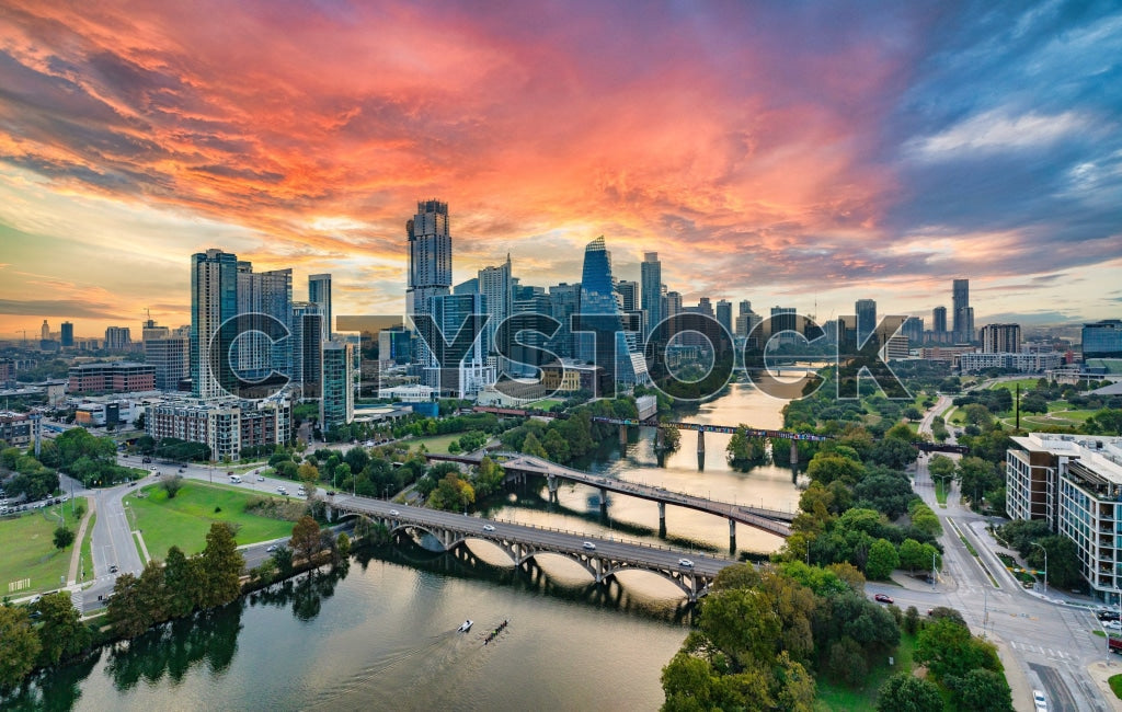 Austin cityscape at sunset, featuring Congress Avenue Bridge
