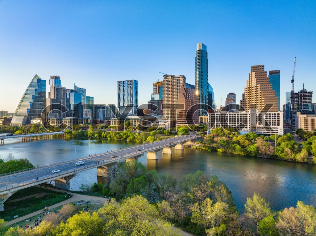 Aerial view of Austin skyline by Colorado River during sunset