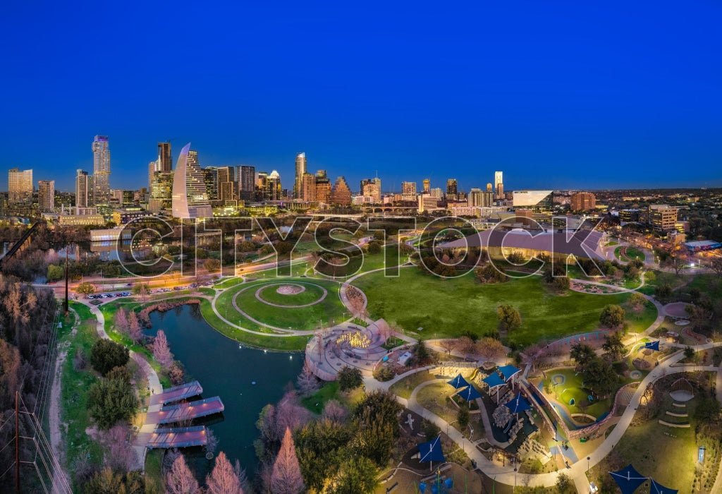 Vibrant sunset over Austin showing parks and city skyline