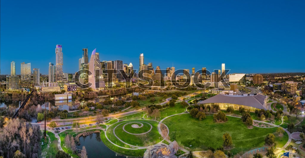 Aerial view of Austin skyline and green park at sunrise