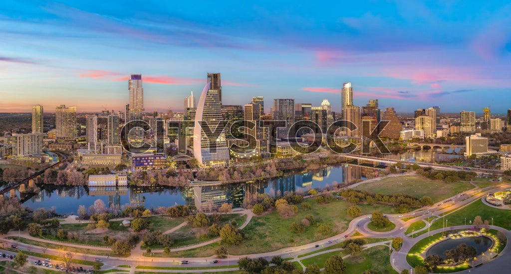 Aerial view of Austin skyline and river at sunset with city lights