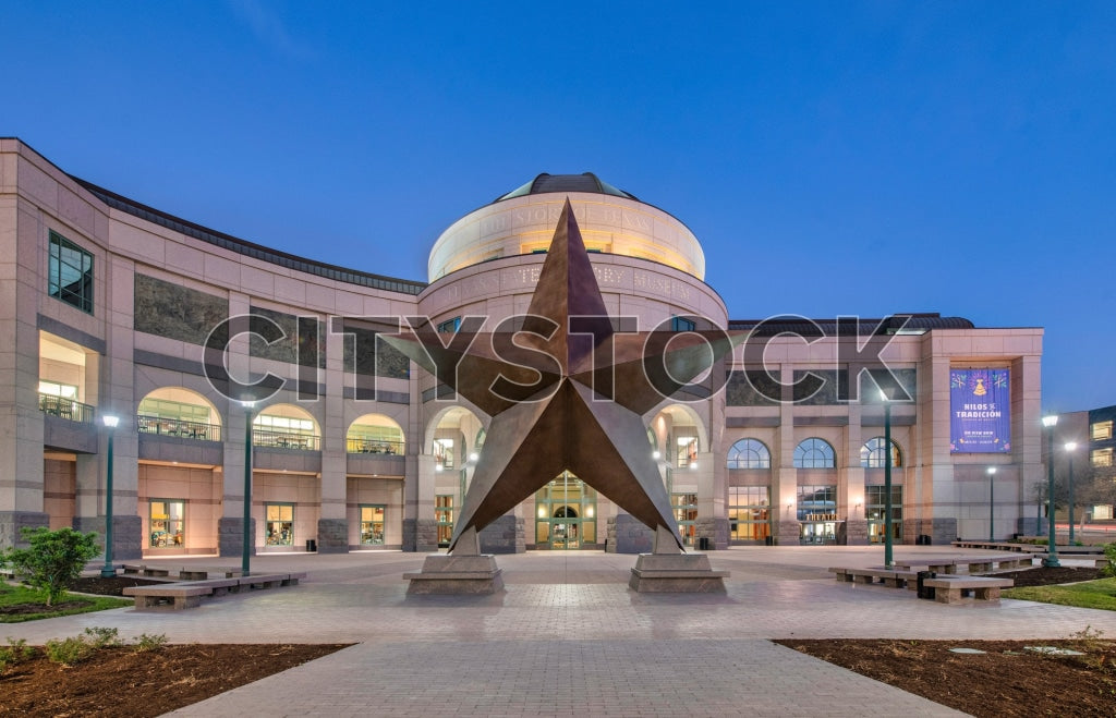 Evening view of a modern building with iconic sculpture in Austin, Texas