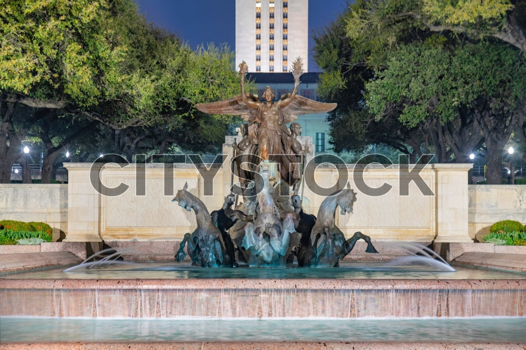 Illuminated fountain at night with urban architecture in Austin, Texas