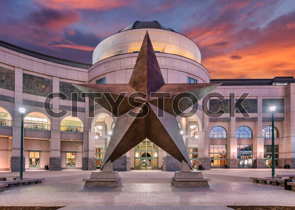 Vibrant sunset at Austin State History Museum with star sculpture