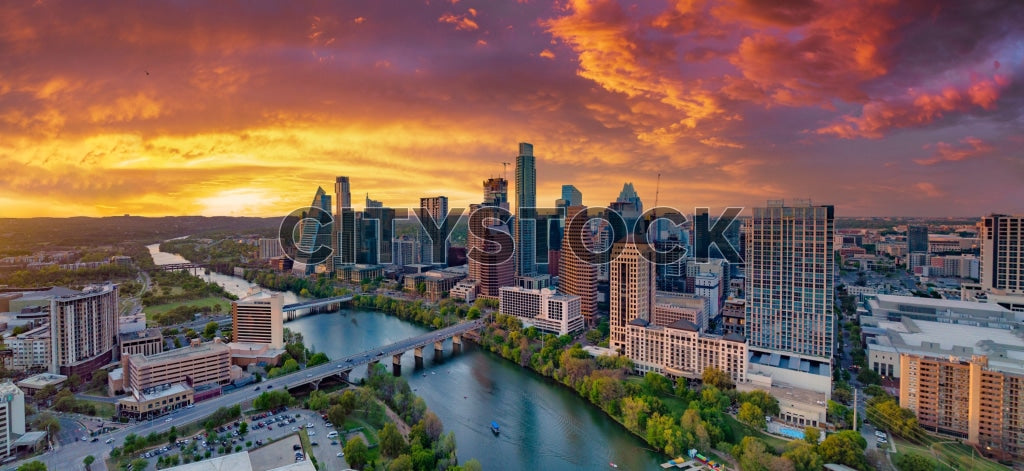 Aerial sunset view of Austin skyline with Colorado River