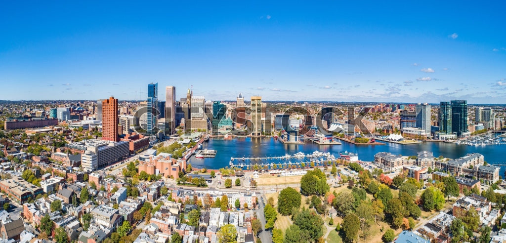 Aerial view of Baltimore's waterfront and cityscape under blue sky