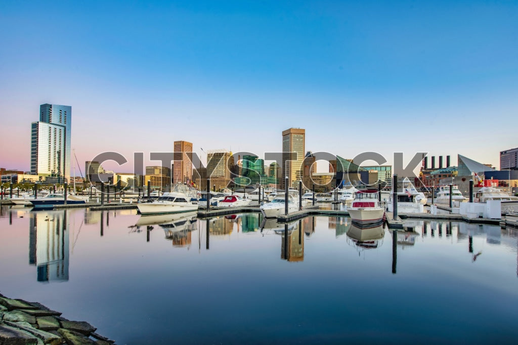 Sunrise view of Baltimore cityscape with harbor and boats