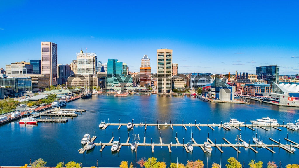 Aerial view of Baltimore Harbor with yachts and urban skyline