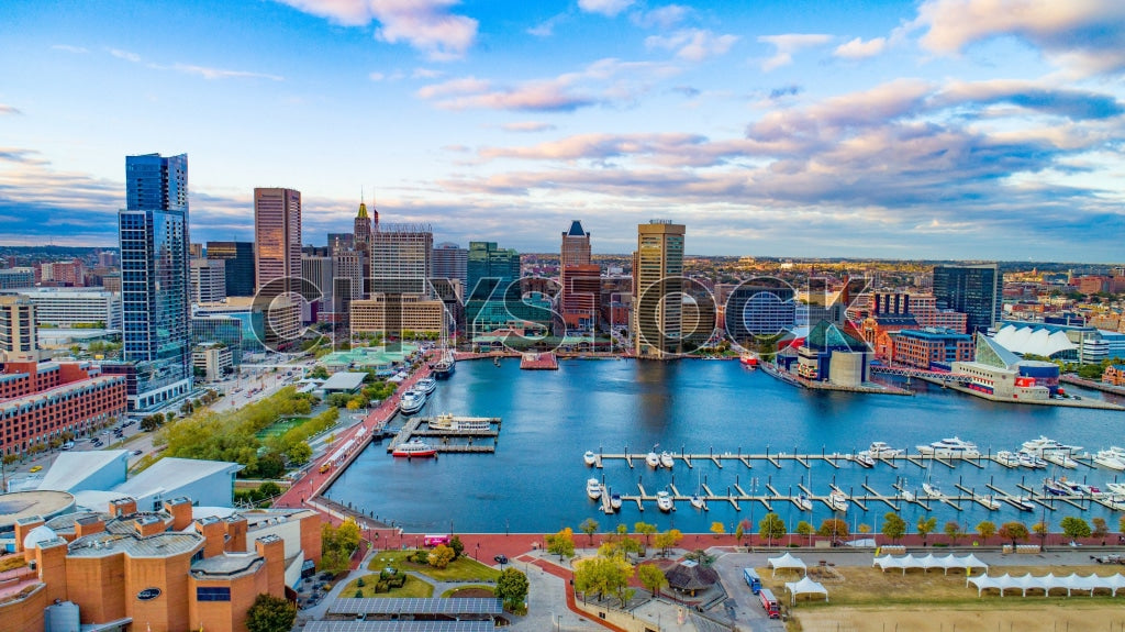 Aerial view of Baltimore Inner Harbor at sunrise showcasing city landmarks