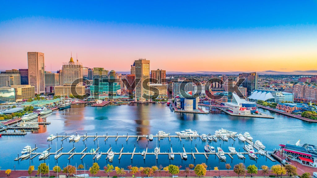 Aerial view of Baltimore Inner Harbor at sunrise showcasing the cityscape and waterfront