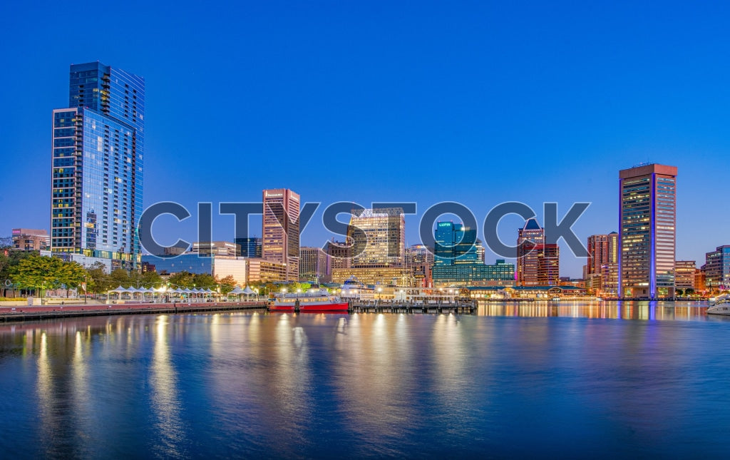 Baltimore skyline and waterfront at sunset with city lights