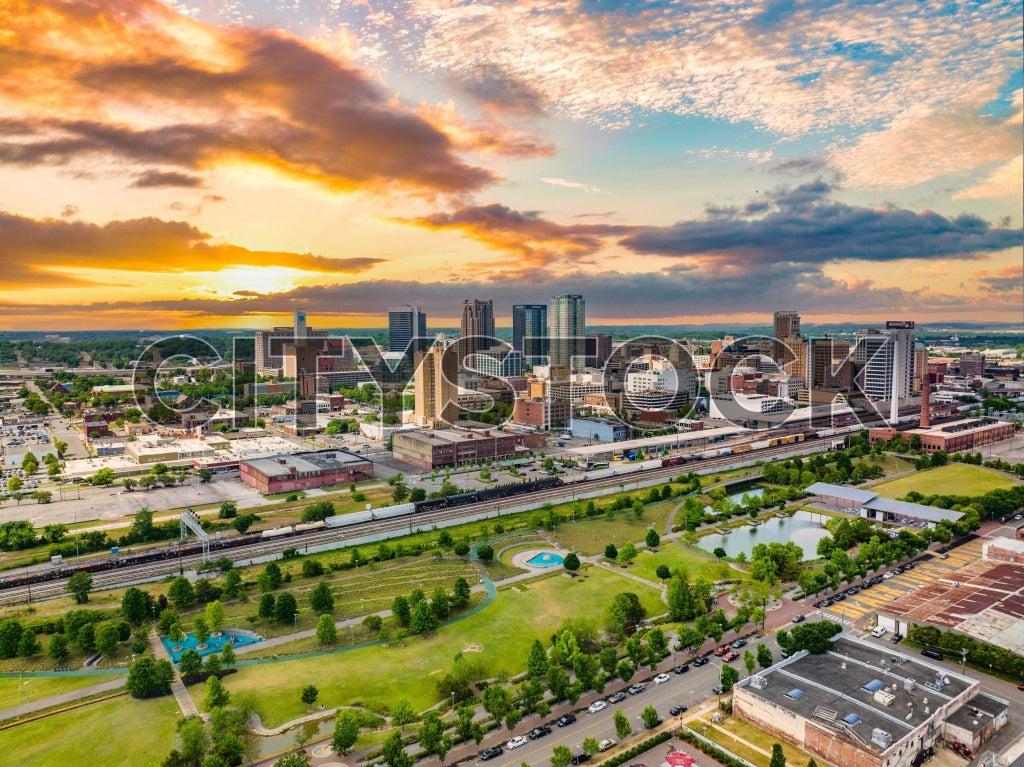 Aerial view of Birmingham, Alabama skyline at sunrise with clouds