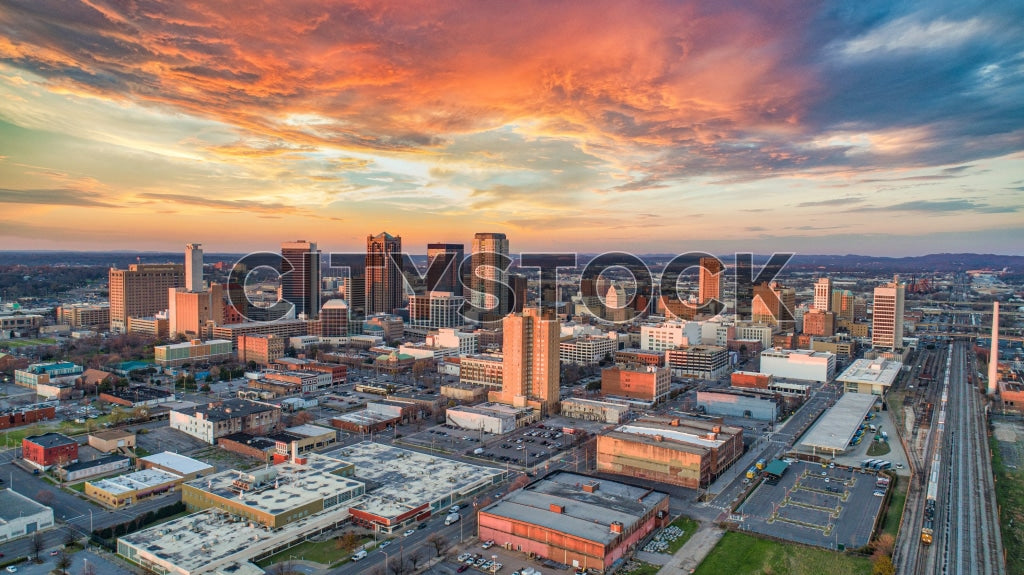 Aerial view of sunrise illuminating Birmingham skyline