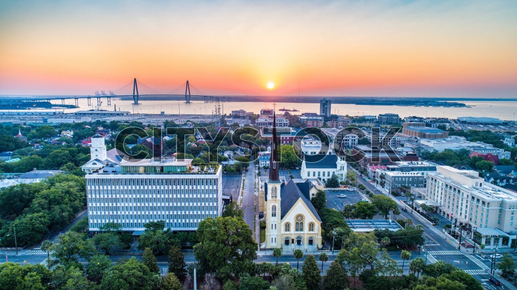 Sunrise illuminating Arthur Ravenel Jr. Bridge and Charleston skyline