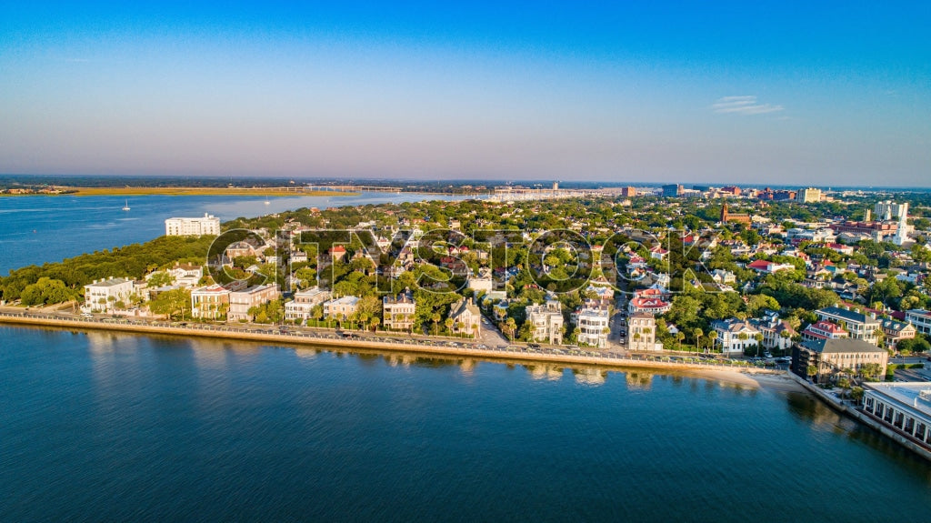 Aerial view of Charleston SC waterfront at sunrise, showcasing the cityscape