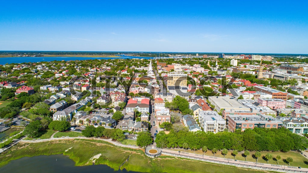 Aerial cityscape view of Charleston, SC featuring historic buildings and waterways