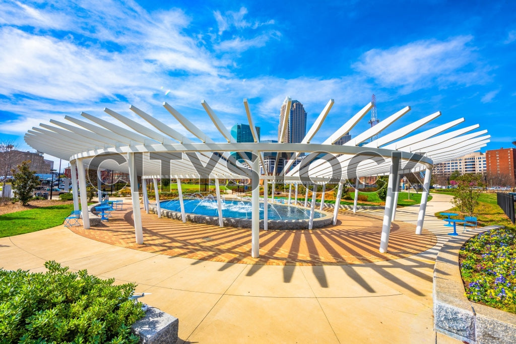 Modern pergola in Charlotte urban park under blue sky