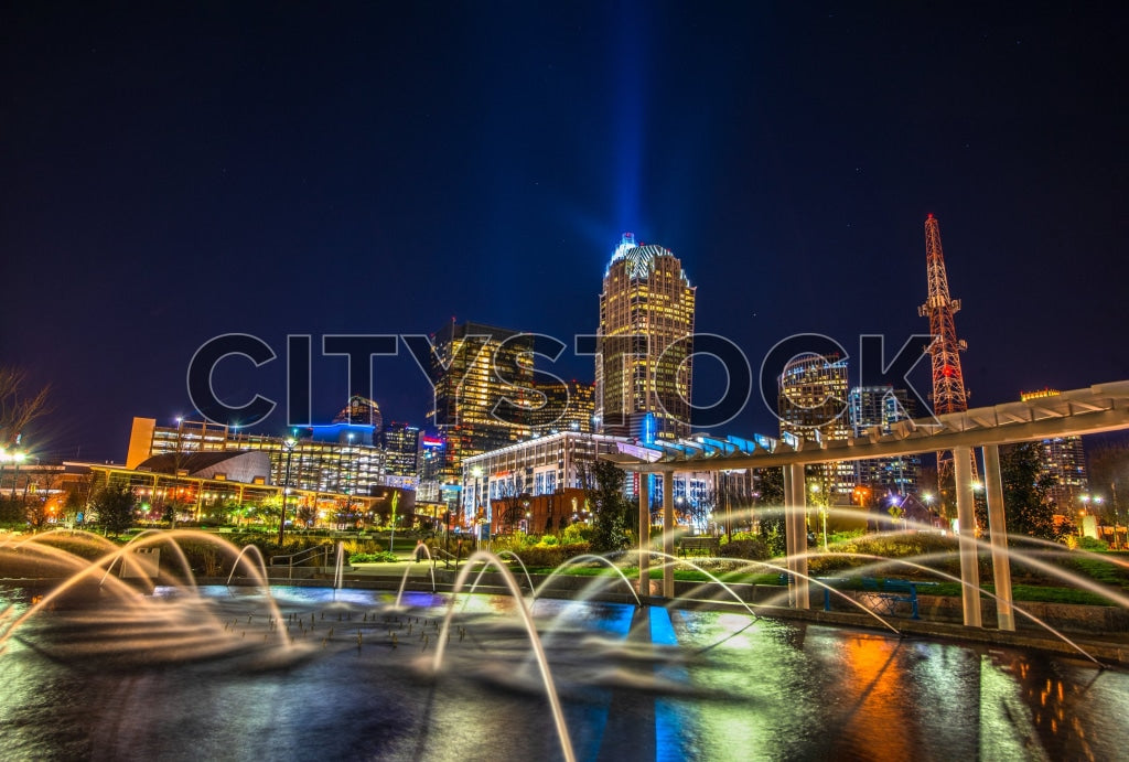 Charlotte NC skyline at night showing illuminated buildings and water