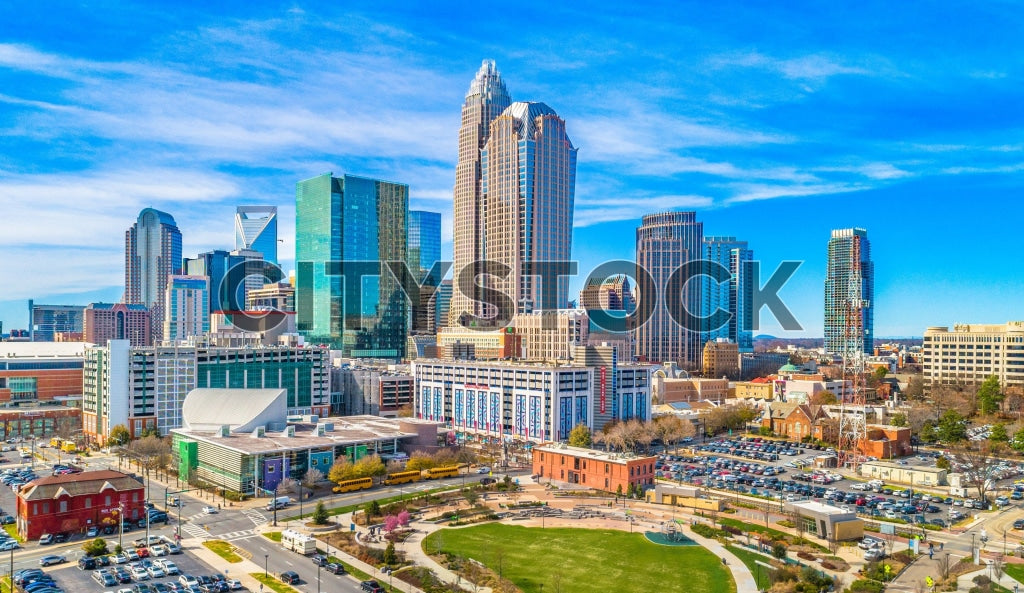 Aerial view of Charlotte skyline with clear blue skies and modern buildings