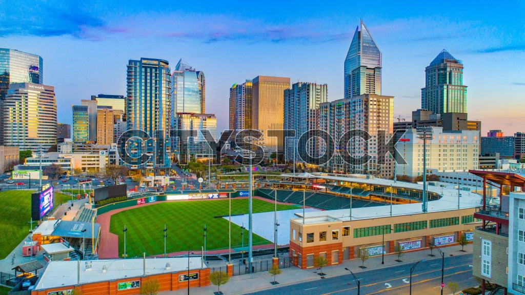 Aerial view of Charlotte NC skyline with Truist Field at sunrise