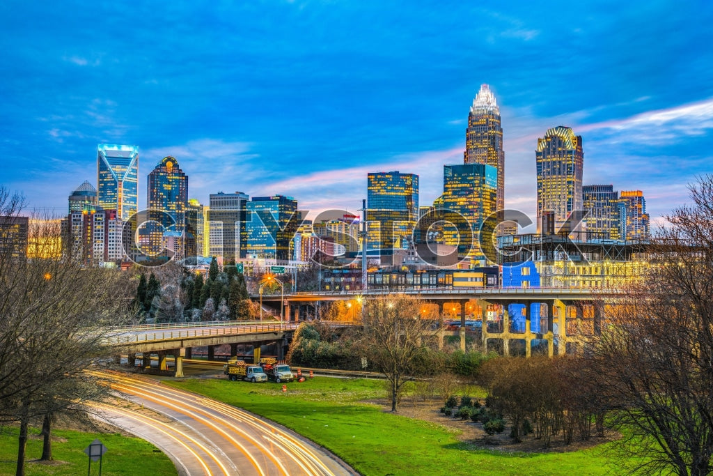 Charlotte NC skyline at twilight, colorful sky and city lights