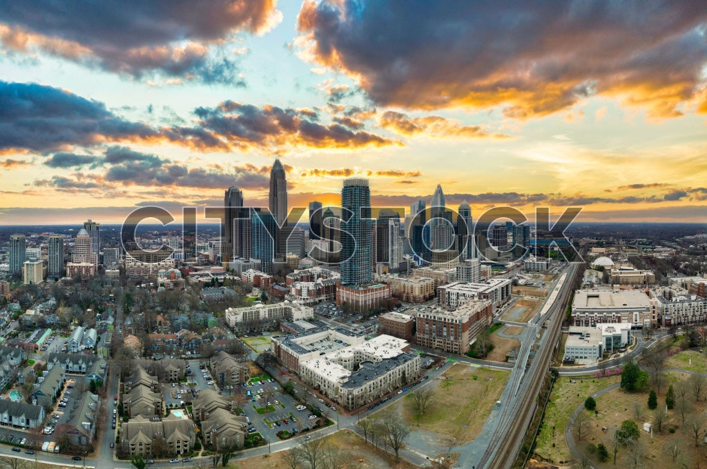 Aerial view of Charlotte, NC skyline during sunset with colorful clouds