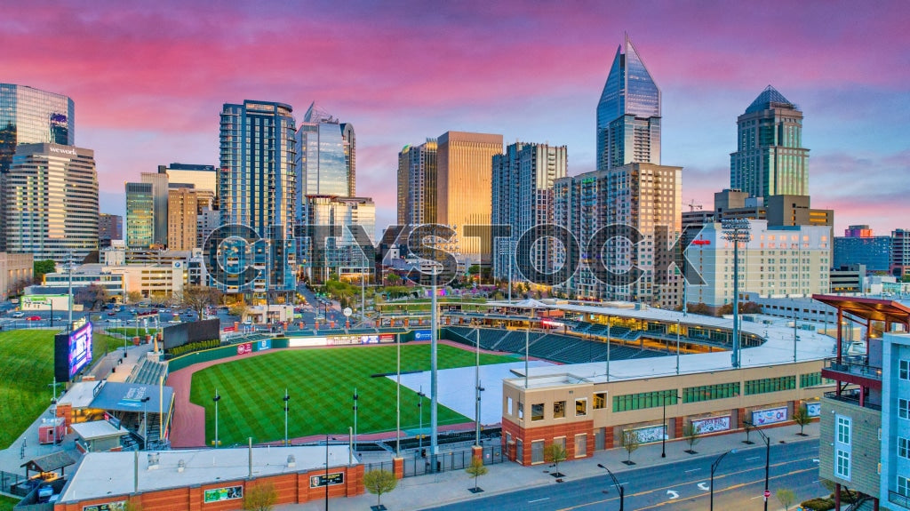 Aerial view of Charlotte NC skyline at sunrise with stadium