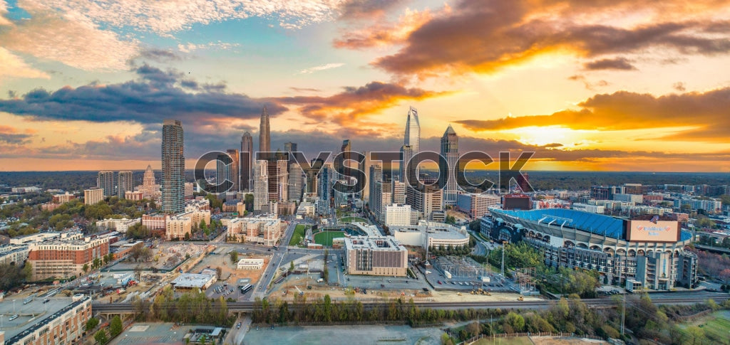 Aerial view of Charlotte NC skyline at sunset featuring landmarks