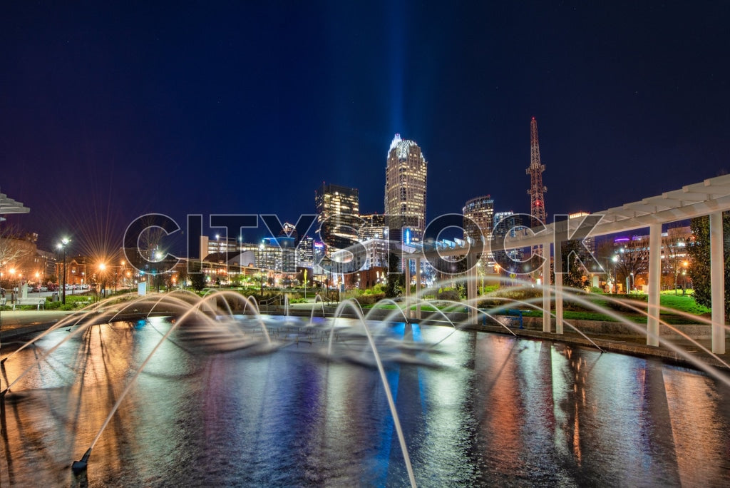 Charlotte, NC skyline and illuminated water fountains at night