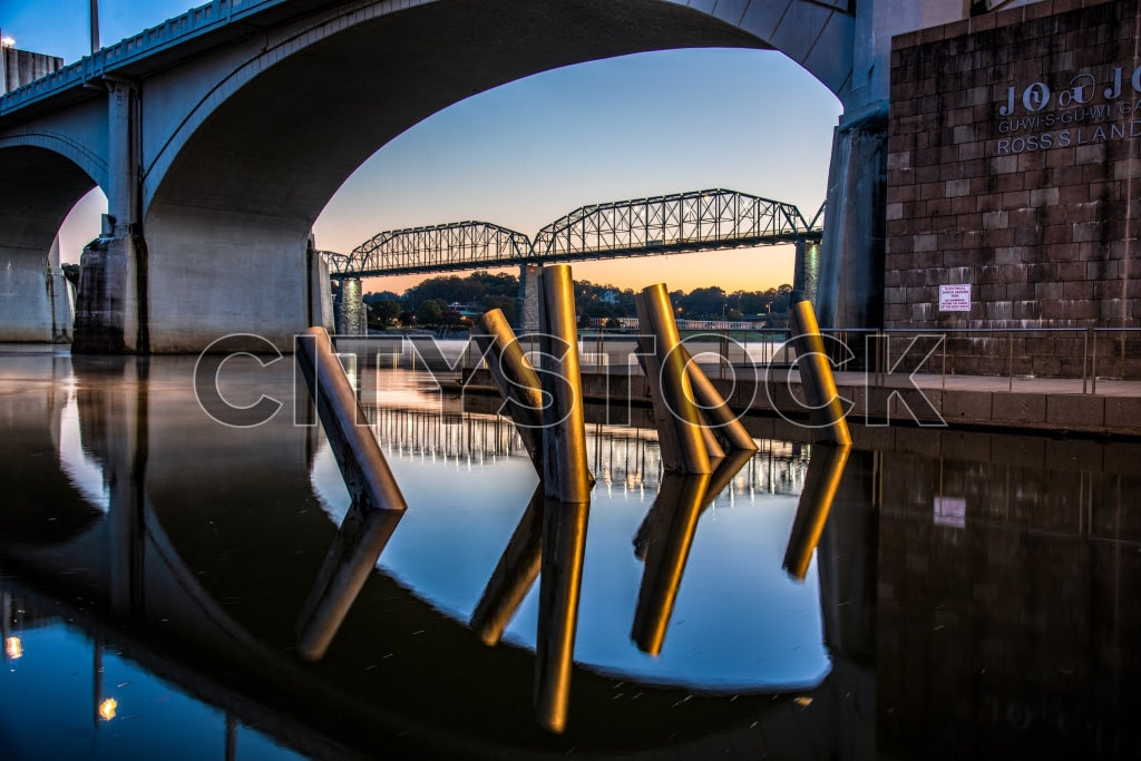 Sunrise view of Chattanooga bridges reflected in Tennessee River