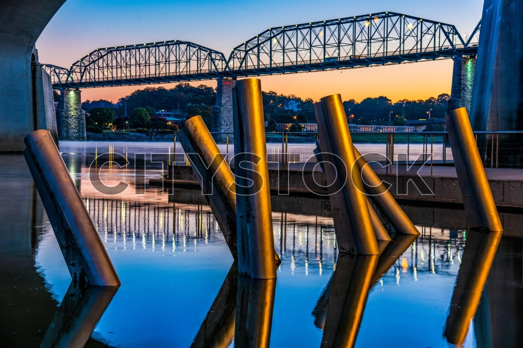 Chattanooga bridge at sunset with reflection on water