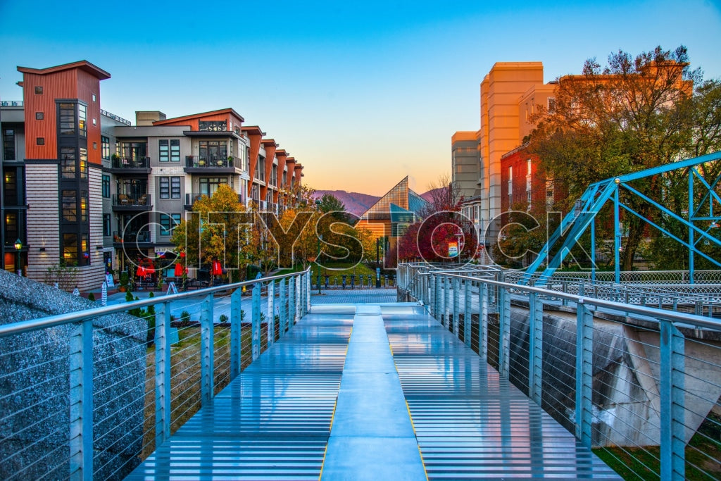 Chattanooga cityscape at sunrise shows modern and historical buildings