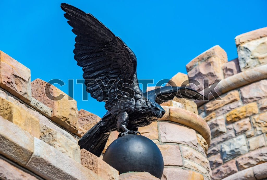 Majestic eagle sculpture againts blue sky and stone masonry, Chattanooga