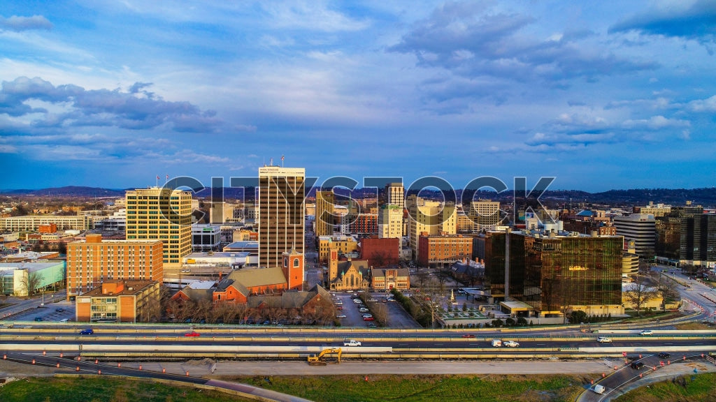 Aerial view of Chattanooga at sunset with golden sky and urban skyline