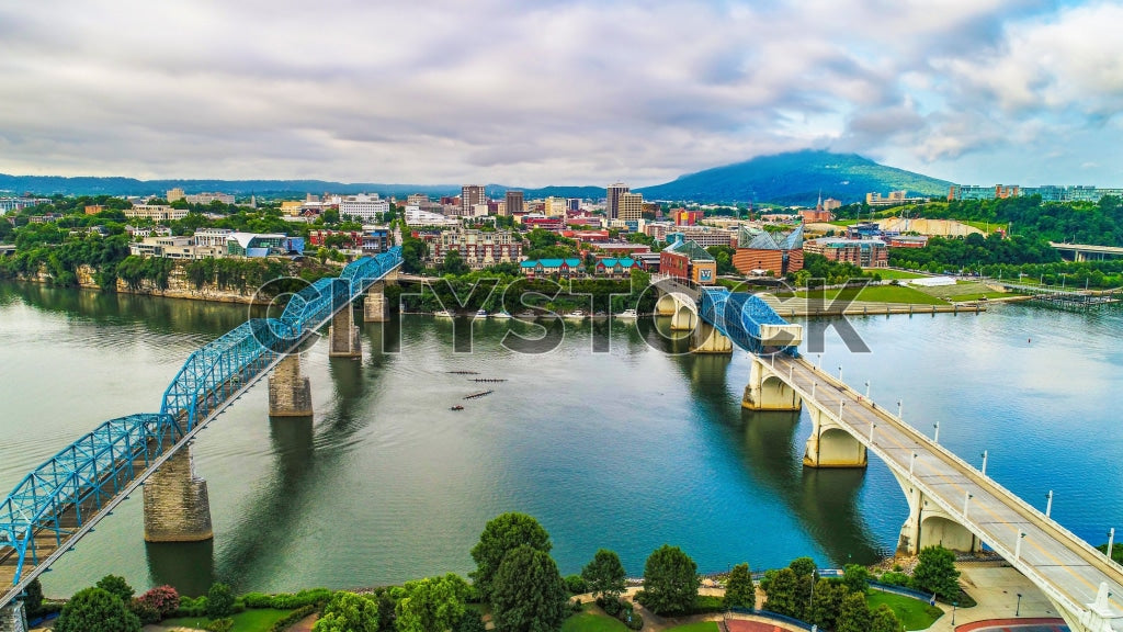 Aerial view of Chattanooga with blue bridges crossing the river