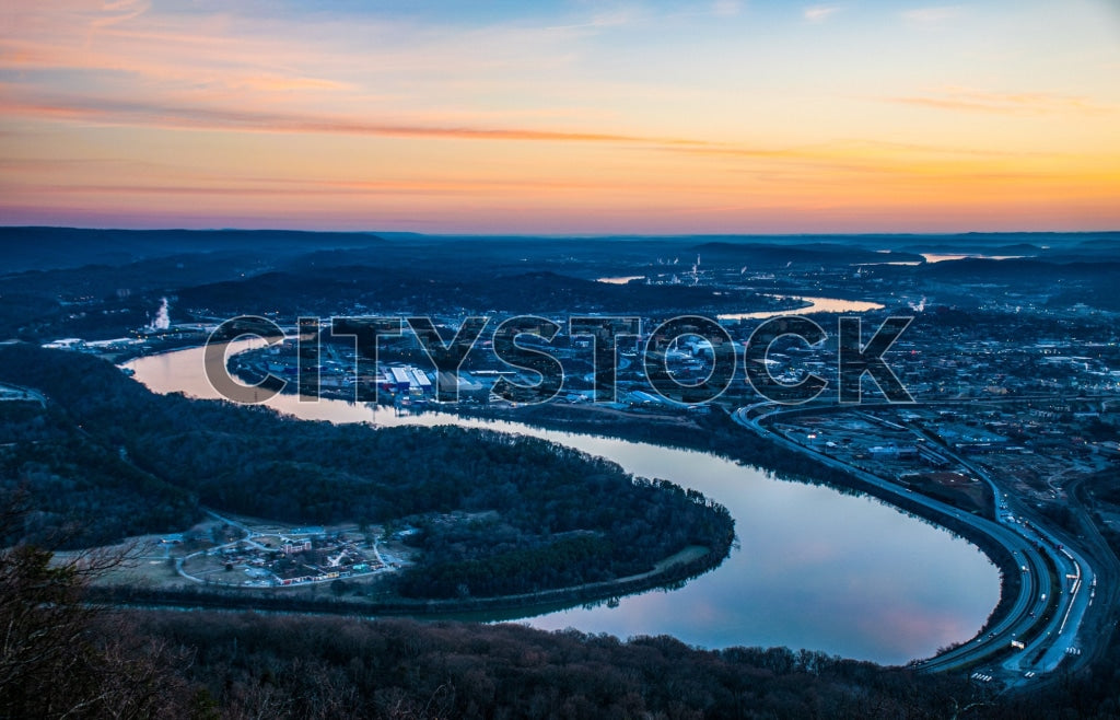 Aerial view of Chattanooga at sunrise showing river and city