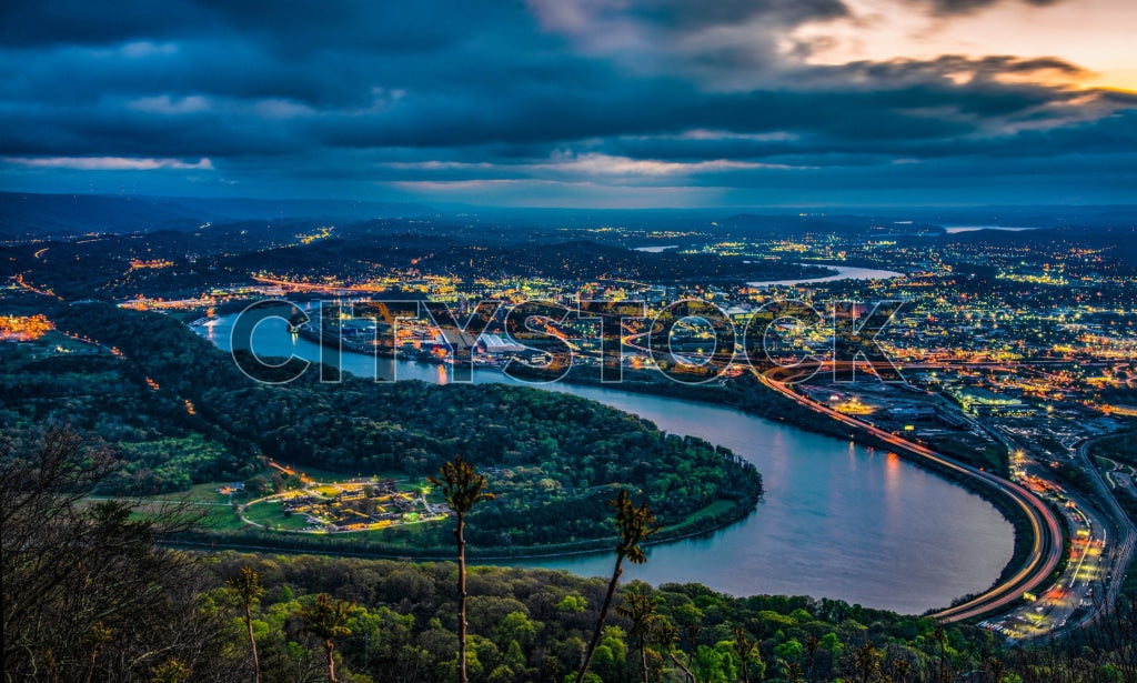 Dramatic twilight view of Chattanooga cityscape with river