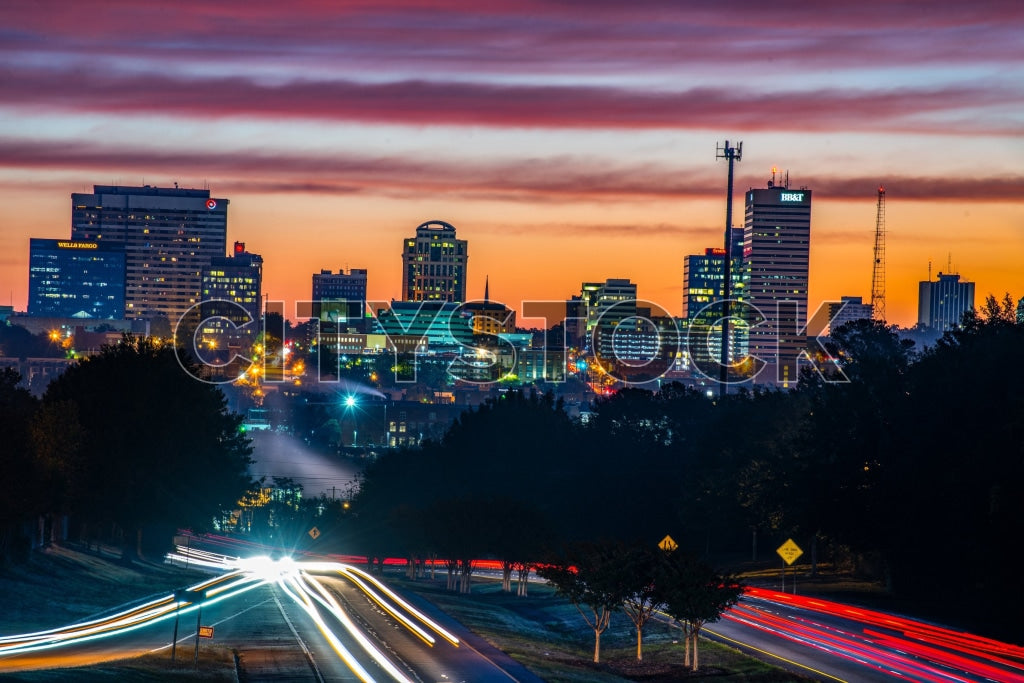 Stunning sunset over Columbia SC skyline with vibrant city lights