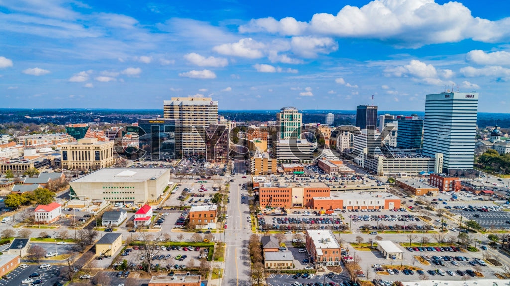 Aerial city view of Columbia, SC under clear blue skies