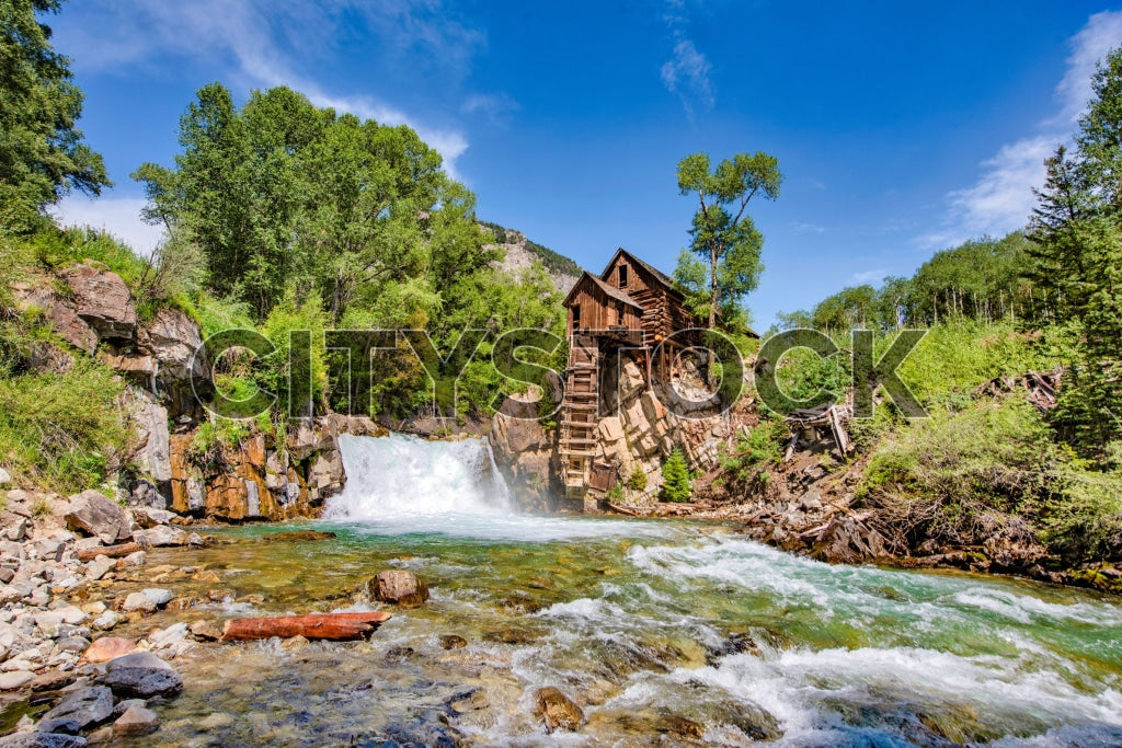 Historic Crystal Mill in Aspen, Colorado with lush greenery